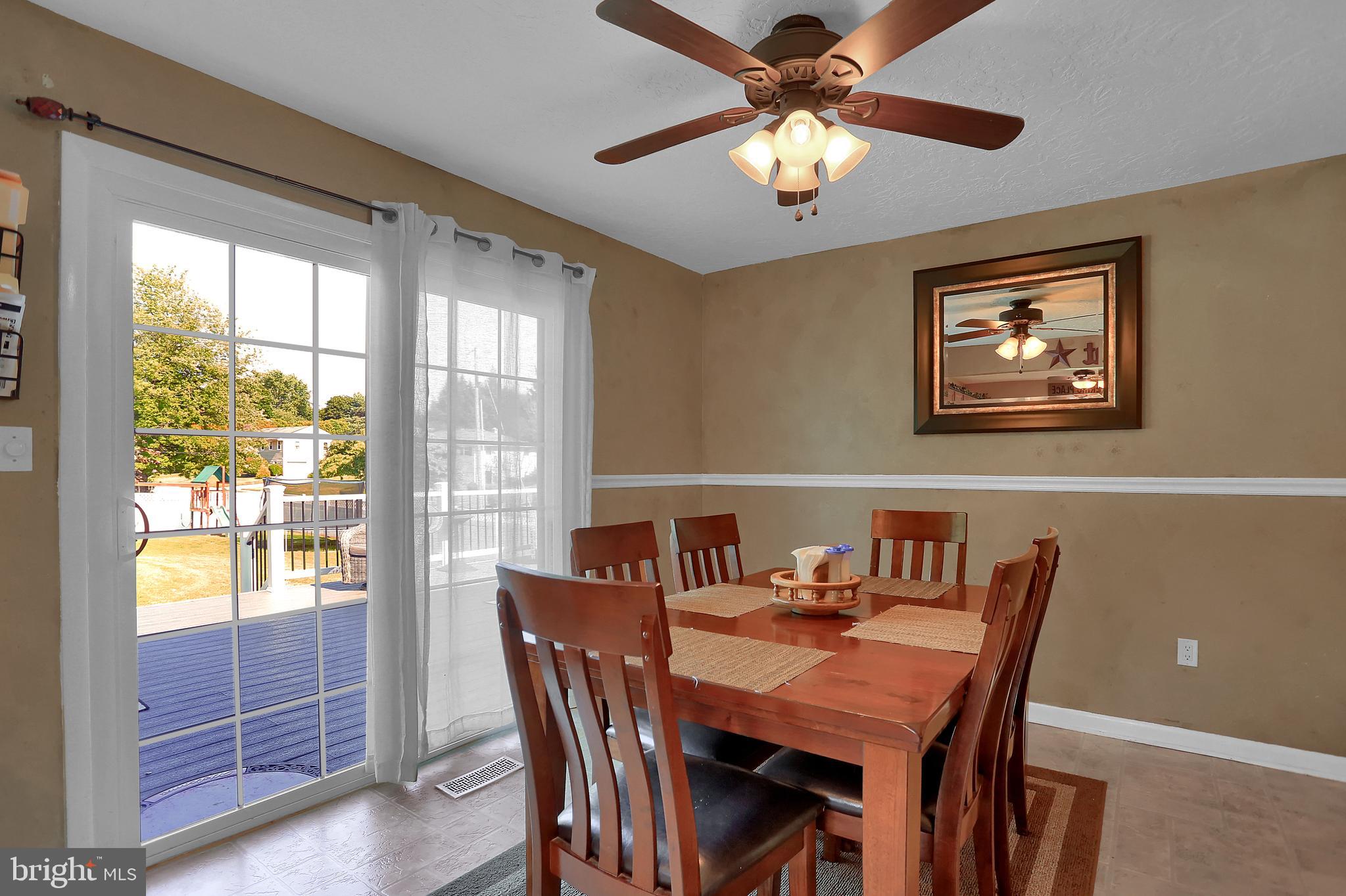 2025 Derry Road York, PA 17408 - Photo 11 of 45 a view of a dining room with furniture window and outside view