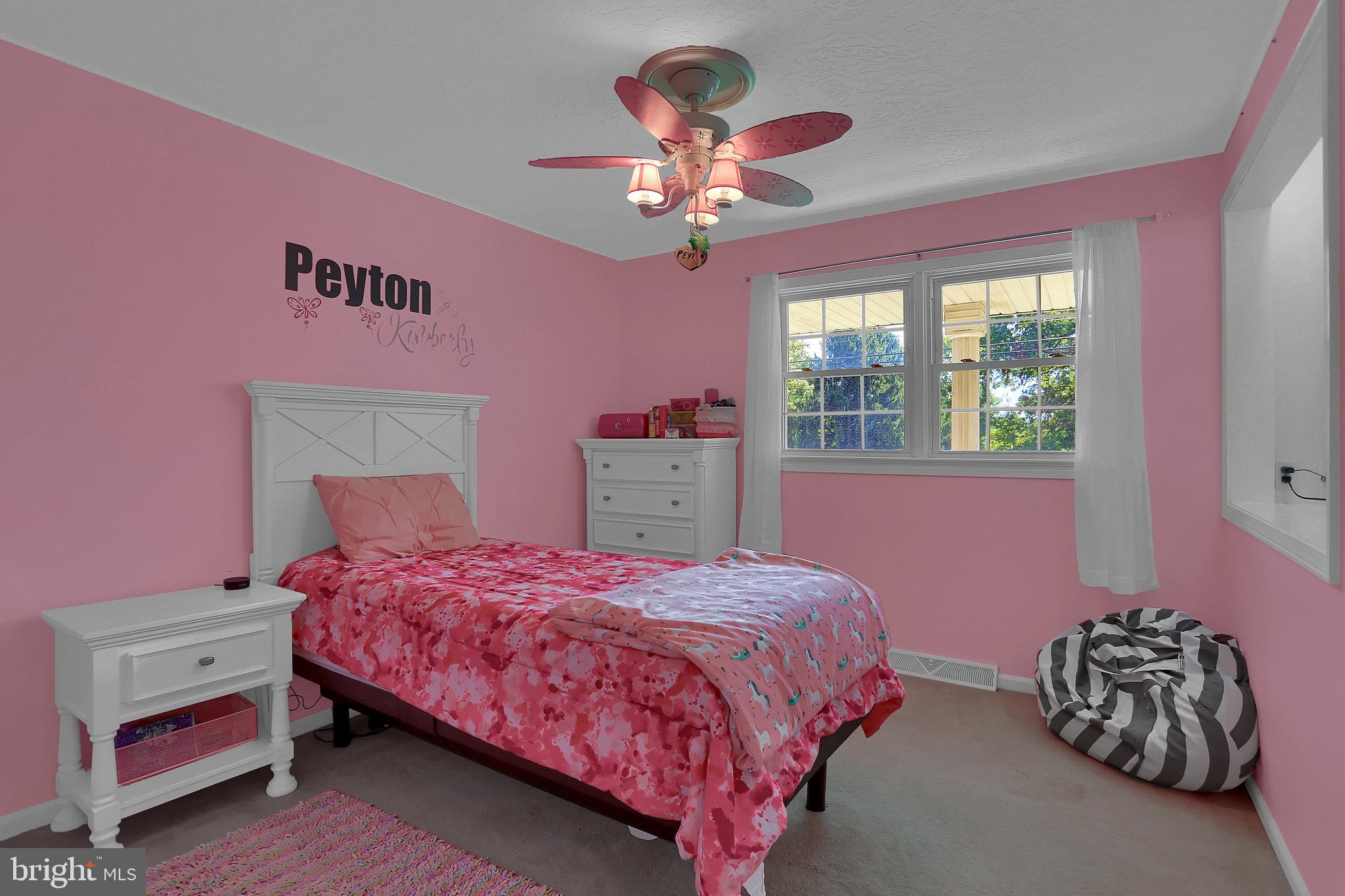 2025 Derry Road York, PA 17408 - Photo 17 of 45 a bedroom with a bed and a chandelier