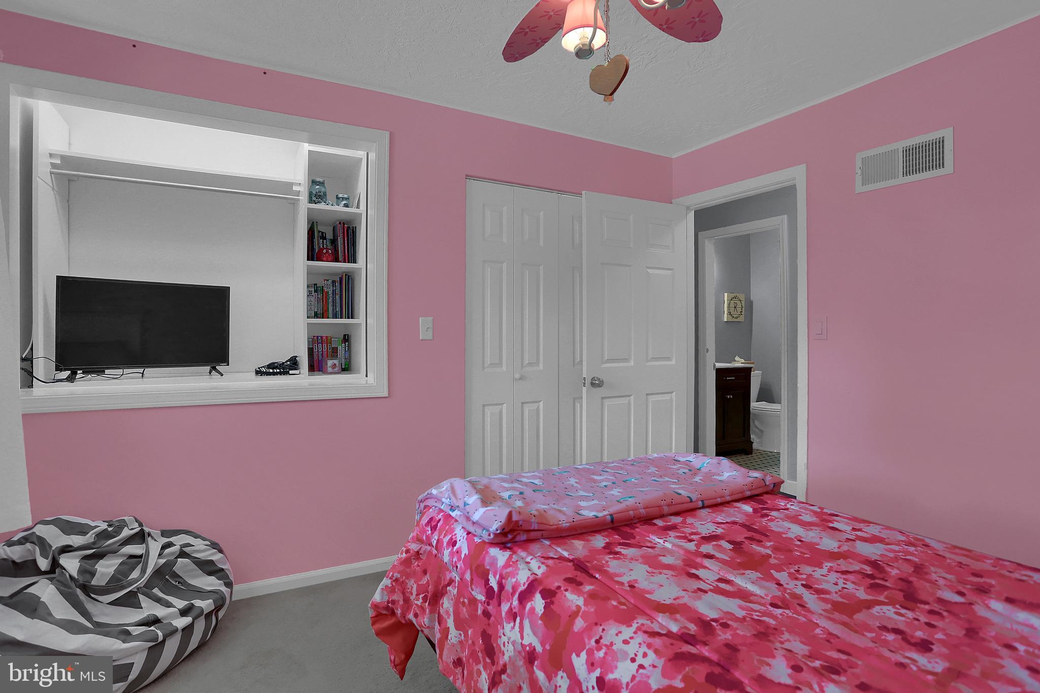 2025 Derry Road York, PA 17408 - Photo 19 of 45 a bedroom with a bed and a flat screen tv