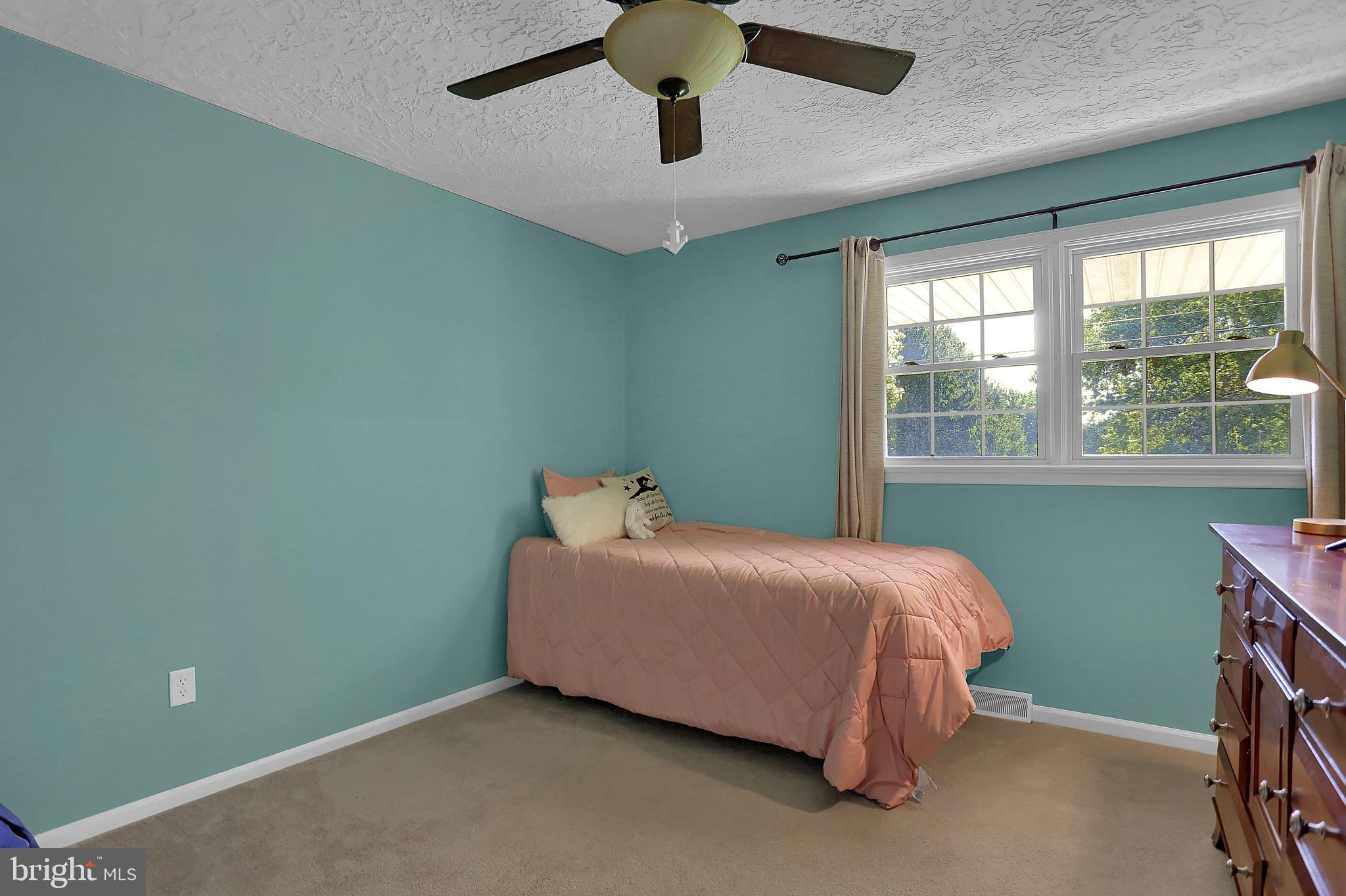 2025 Derry Road York, PA 17408 - Photo 20 of 45 a bed sitting in a bedroom next to a window