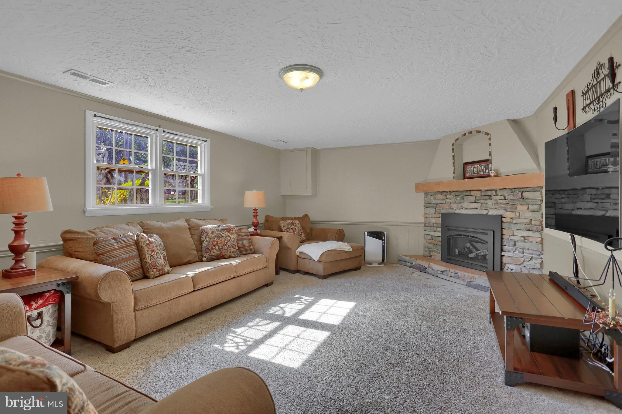 2025 Derry Road York, PA 17408 - Photo 26 of 45 a living room with furniture and a fireplace