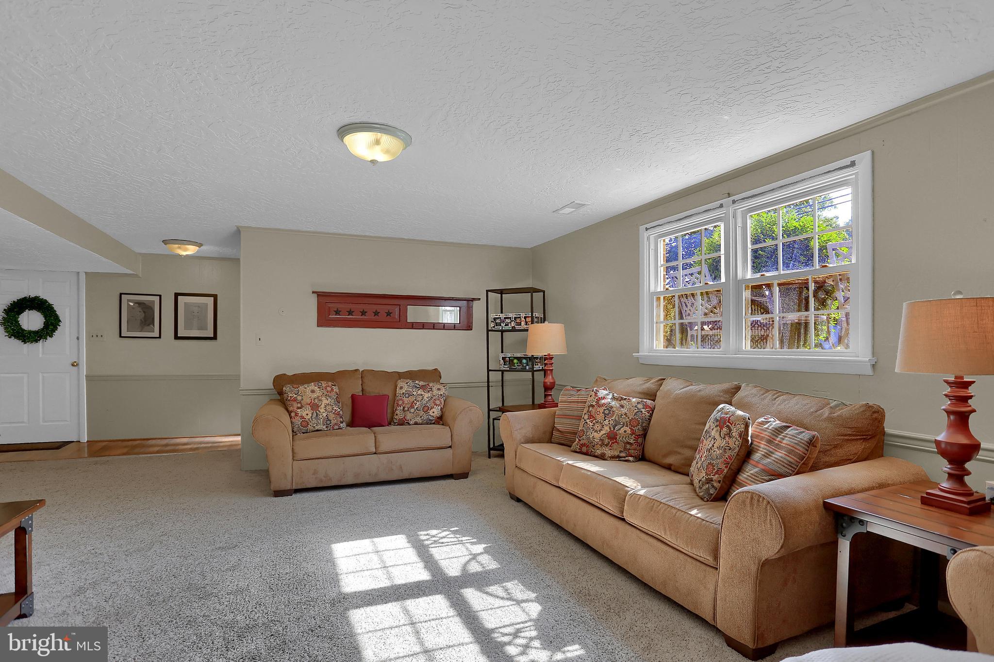 2025 Derry Road York, PA 17408 - Photo 28 of 45 a living room with furniture and a flat screen tv