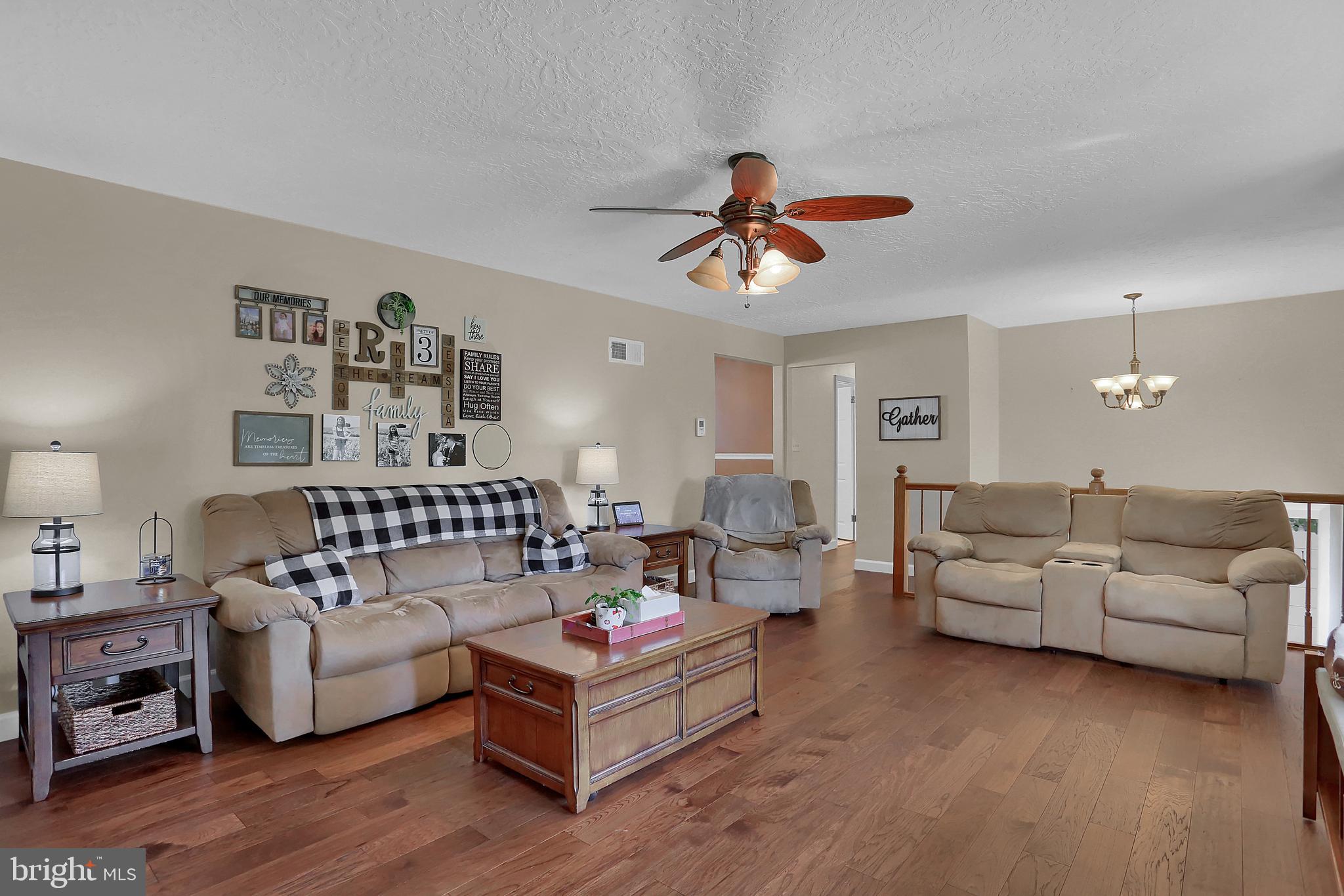 2025 Derry Road York, PA 17408 - Photo 6 of 45 a living room with furniture and a wooden floor