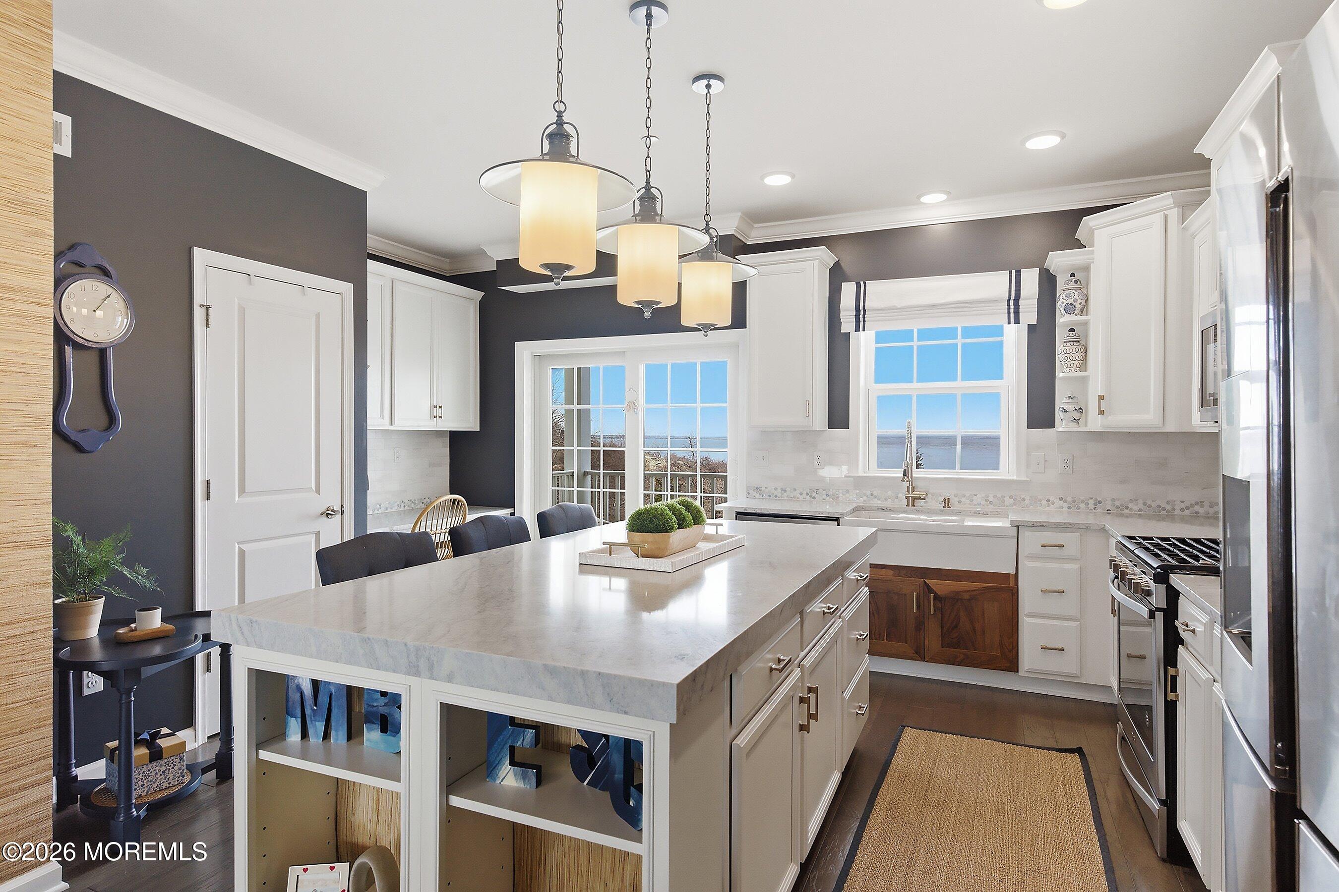 14 Lighthouse Point Road, Unit 604 Highlands, NJ 07732 - Photo 13 of 41 a kitchen with stainless steel appliances granite countertop a stove and a sink