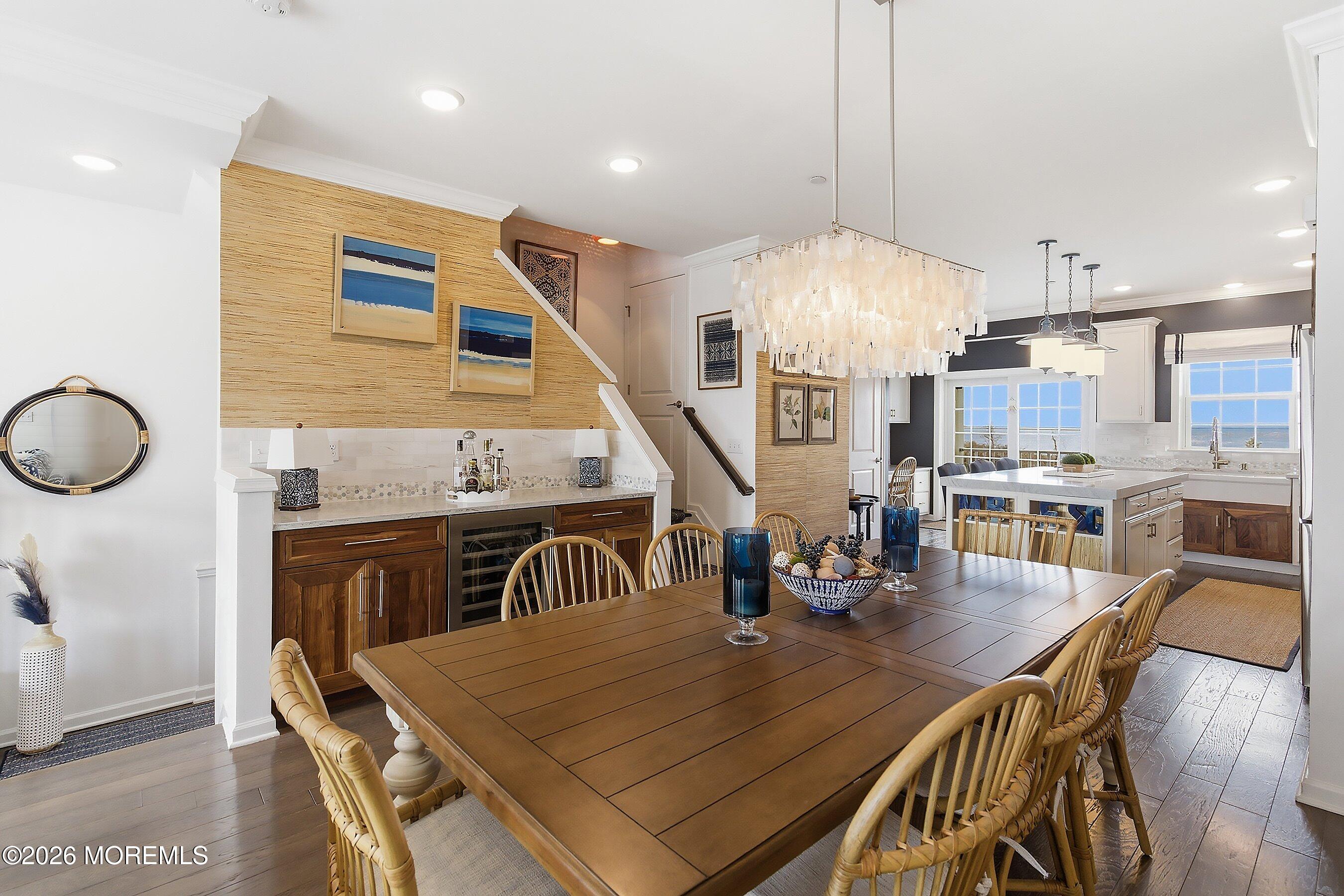 14 Lighthouse Point Road, Unit 604 Highlands, NJ 07732 - Photo 16 of 41 a dining room with furniture a chandelier and wooden floor