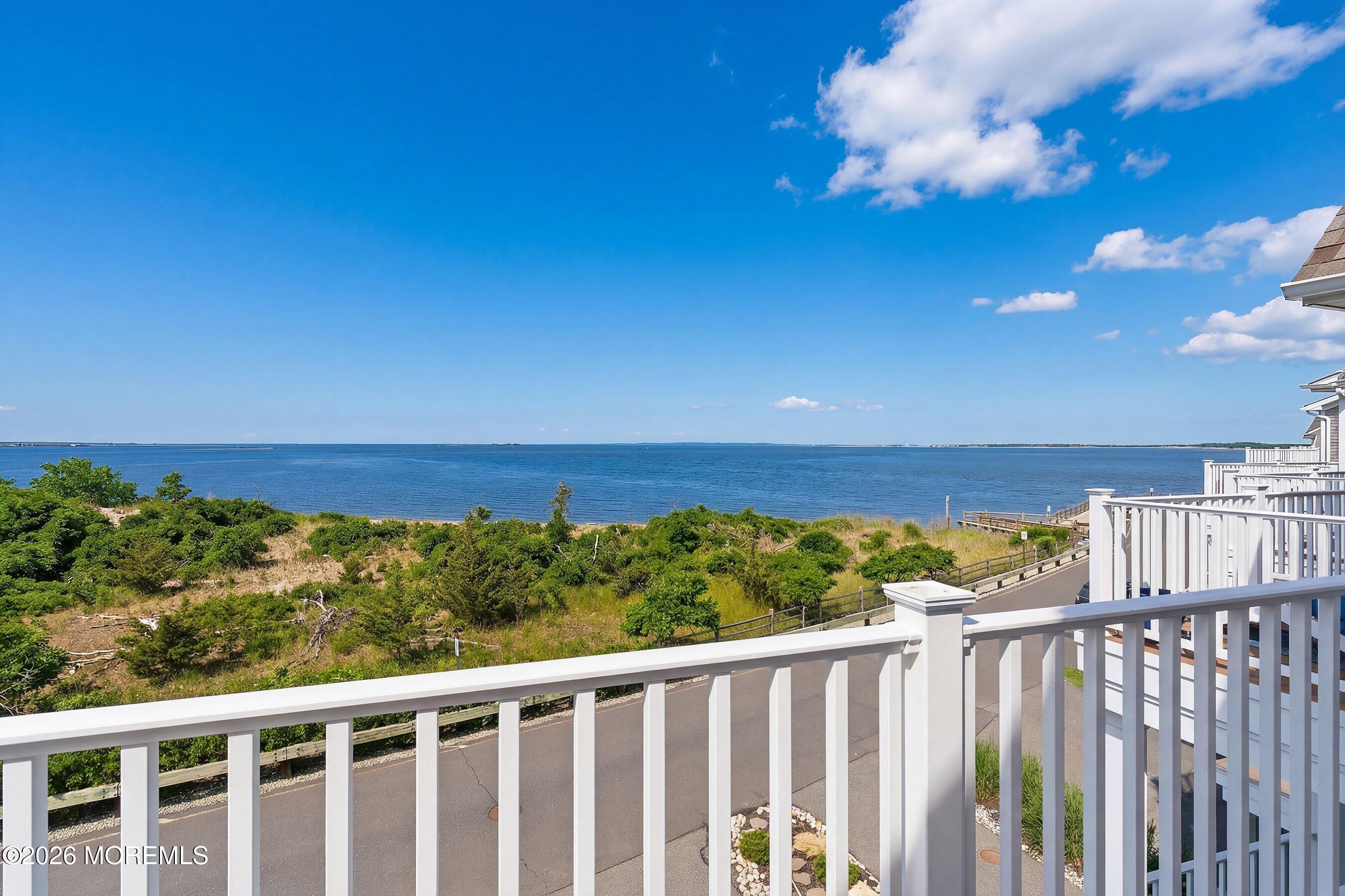 14 Lighthouse Point Road, Unit 604 Highlands, NJ 07732 - Photo 20 of 41 a view of balcony with wooden floor and fence