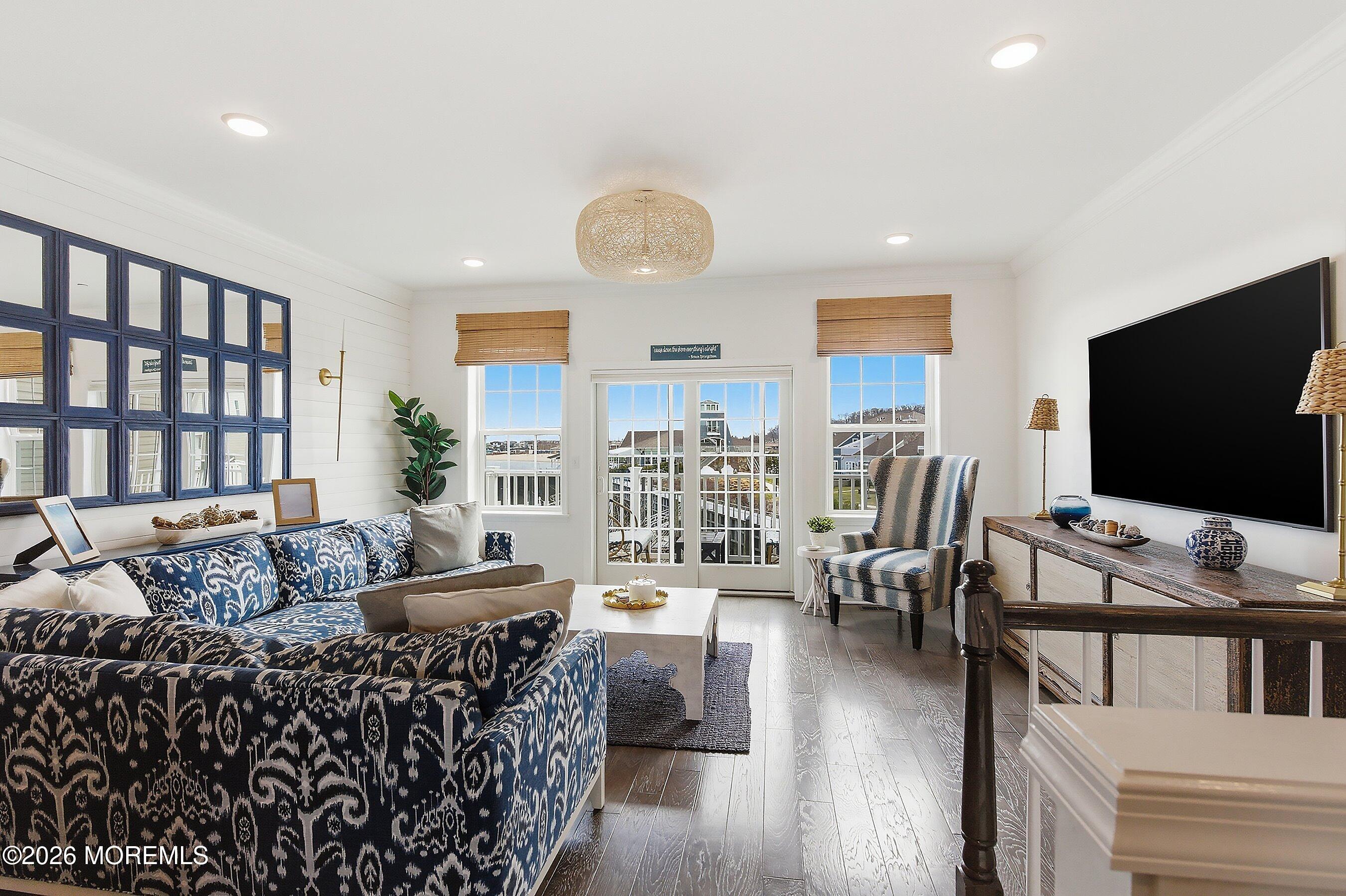 14 Lighthouse Point Road, Unit 604 Highlands, NJ 07732 - Photo 6 of 41 a living room with furniture and a flat screen tv