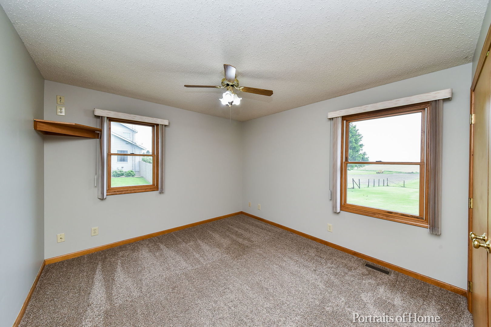 10522 Perry Road DeKalb, IL 60115 - Photo 12 of 27 a view of an empty room with a window