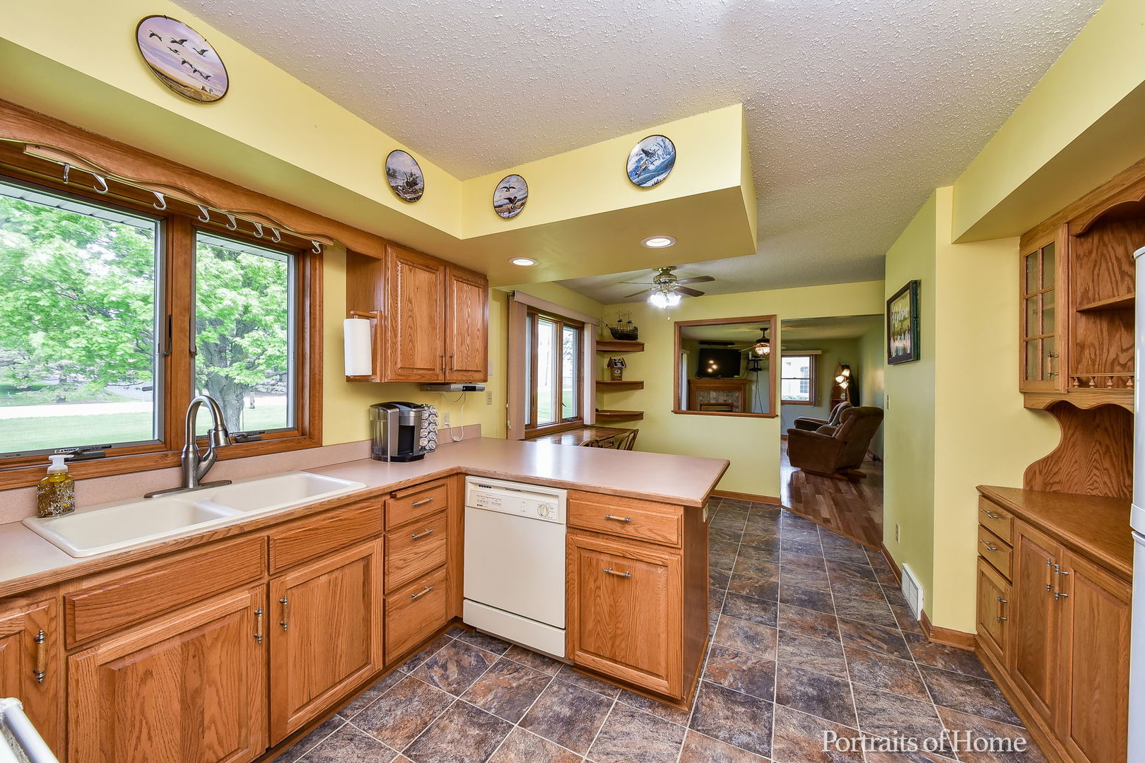 10522 Perry Road DeKalb, IL 60115 - Photo 8 of 27 a large white kitchen with a large window