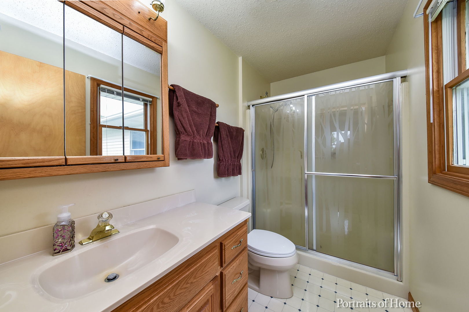 10522 Perry Road DeKalb, IL 60115 - Photo 10 of 27 a bathroom with a sink toilet and shower