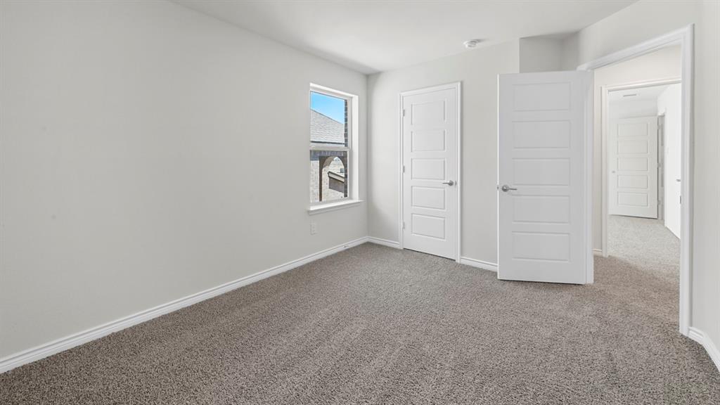 2328 Chloe Lane Anna, TX 75409 - Photo 12 of 37 an empty room with windows and closet