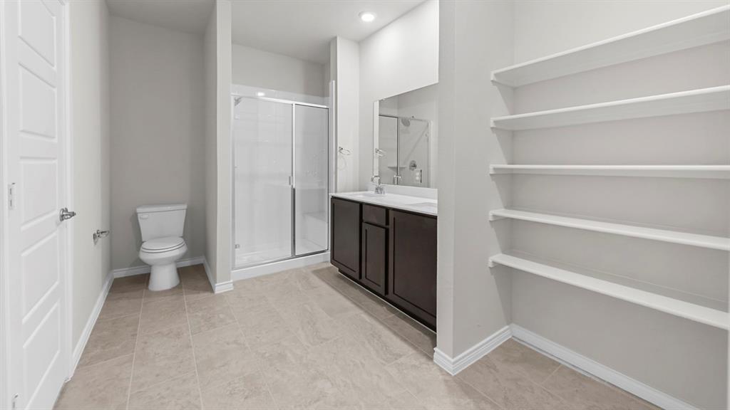 2328 Chloe Lane Anna, TX 75409 - Photo 3 of 37 a view of bathroom with a toilet sink and a bathtub