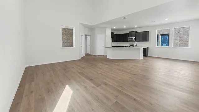 a view of kitchen with sink and wooden floor