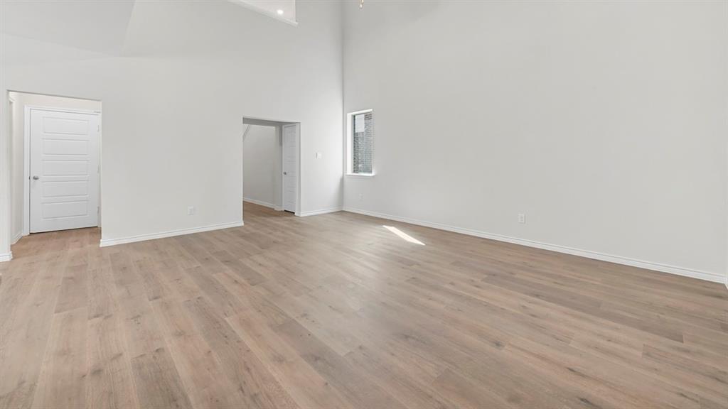 2328 Chloe Lane Anna, TX 75409 - Photo 35 of 37 a view of an empty room with wooden floor