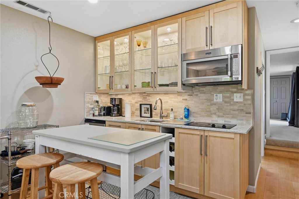 17432 Greenridge Road Hidden Valley Lake, CA 95467 - Photo 55 of 72 a kitchen with stainless steel appliances a sink a stove and white cabinets