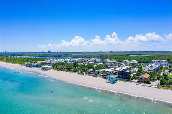 a dining room with furniture window and wooden floor