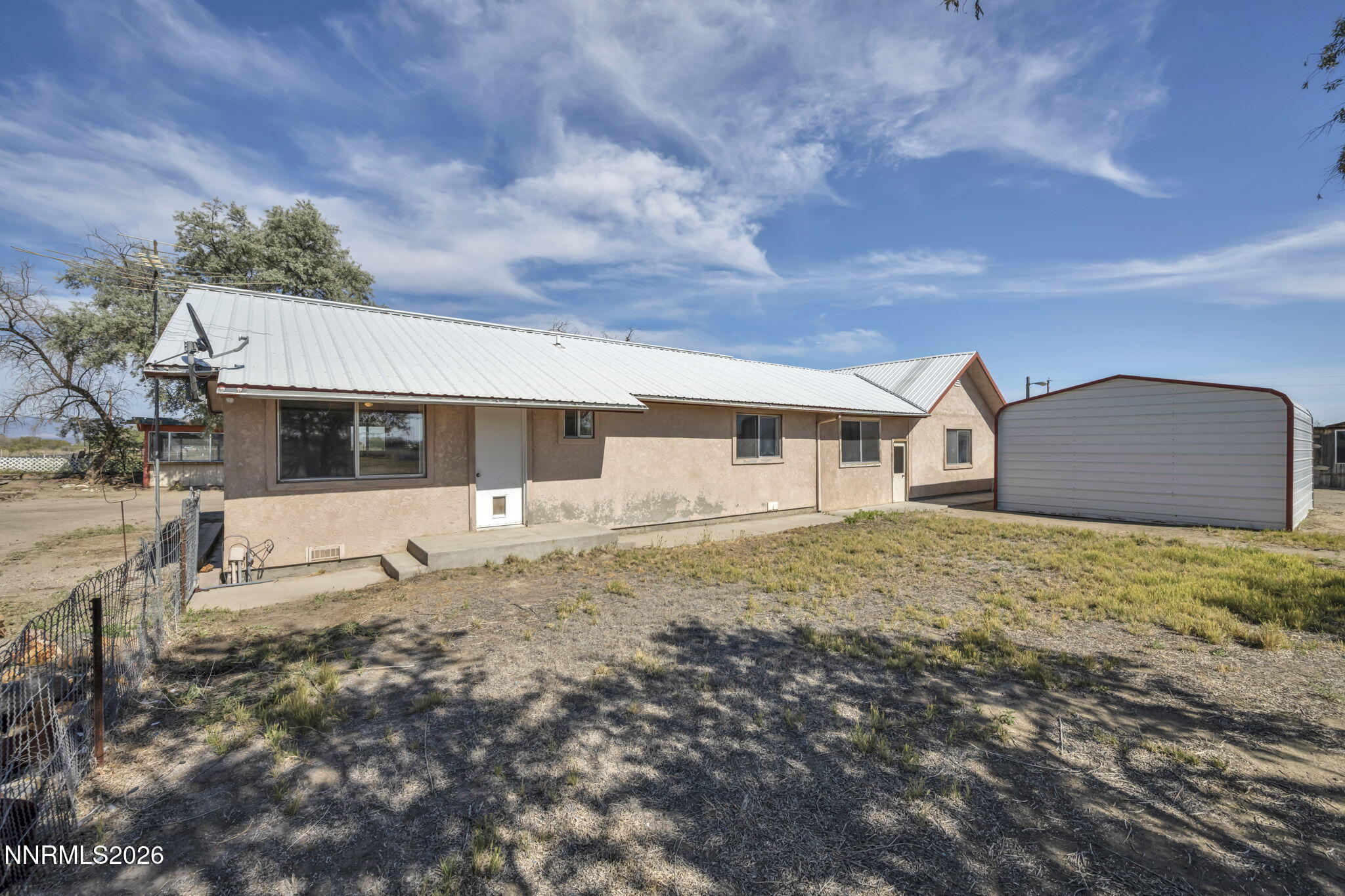 5250 Stillwater Road Fallon, NV 89406 - Photo 5 of 53 a front view of a house with a yard