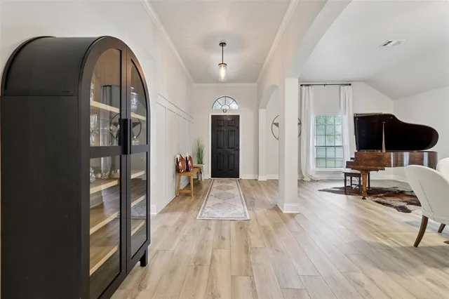 a view of a livingroom with furniture and wooden floor
