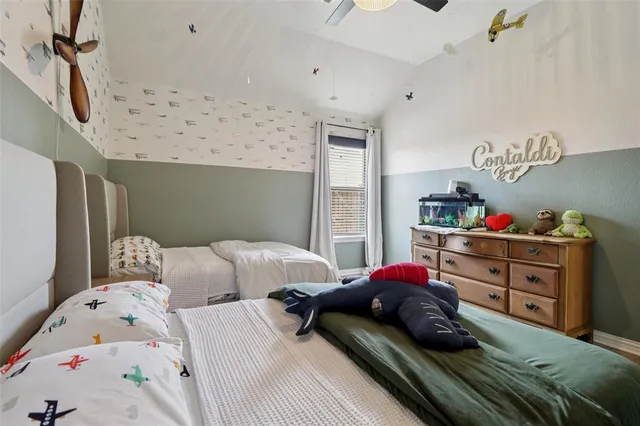 a bedroom with bed and a window