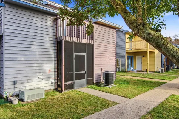 a view of a house with a yard and plants
