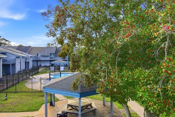 a view of a house with backyard porch and sitting area