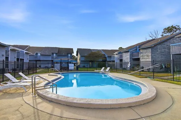 a view of a swimming pool with a lounge chairs