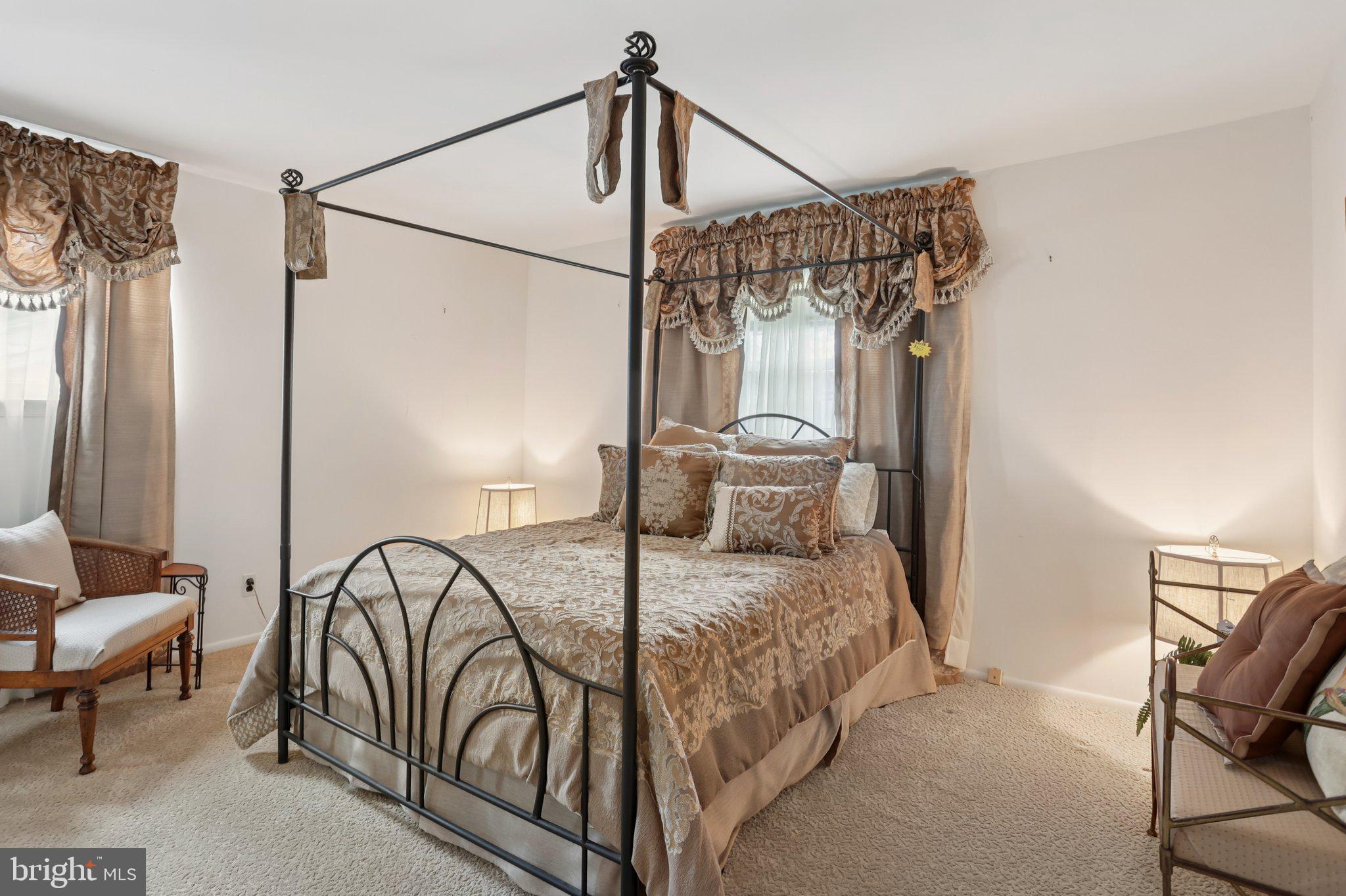 26 Regent Road Cherry Hill, NJ 08003 - Photo 18 of 36 a bedroom with a bed a lamp and a window