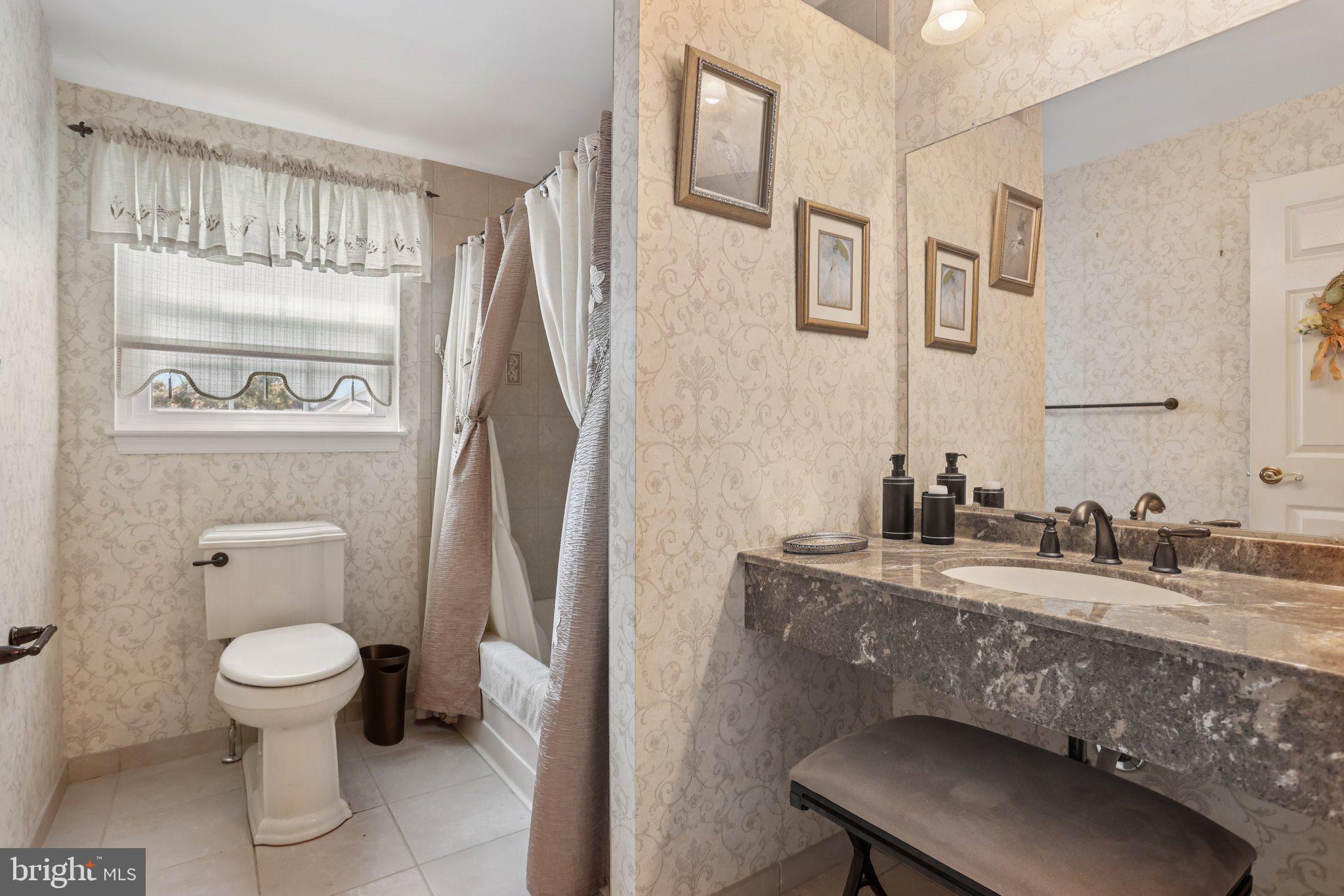 26 Regent Road Cherry Hill, NJ 08003 - Photo 20 of 36 a bathroom with a granite countertop toilet sink and mirror