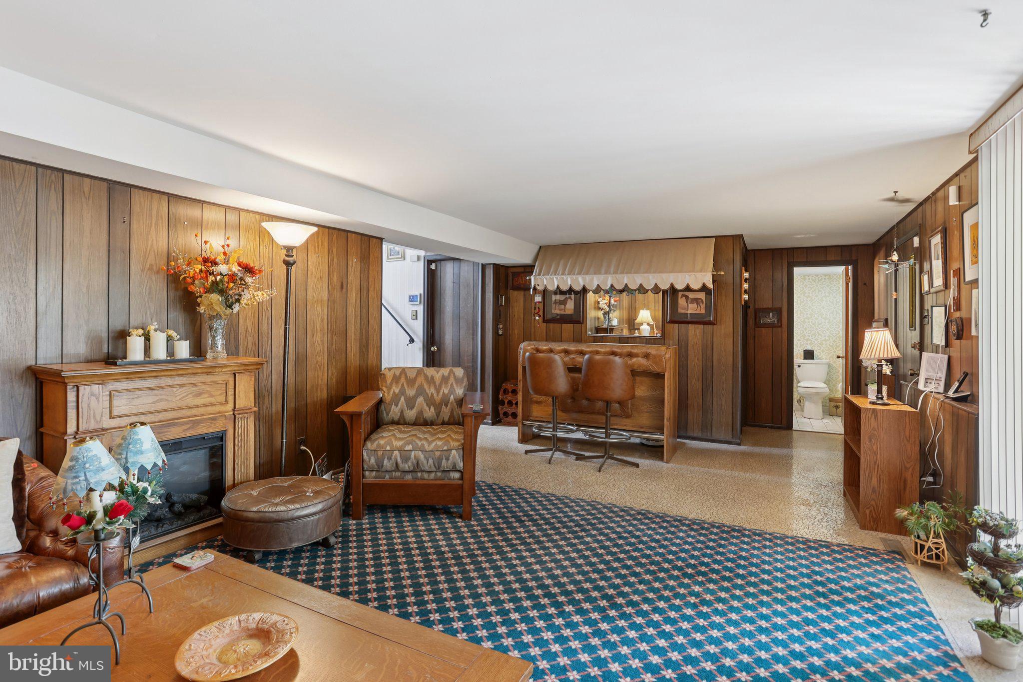 26 Regent Road Cherry Hill, NJ 08003 - Photo 25 of 36 a living room with furniture a dining table and a fireplace