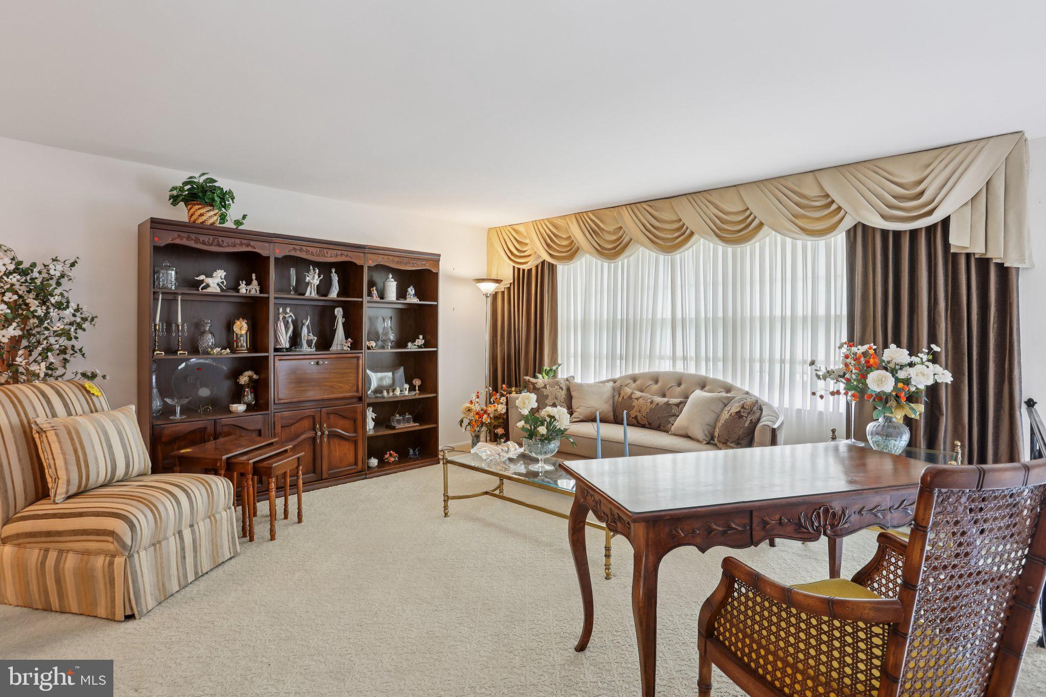 26 Regent Road Cherry Hill, NJ 08003 - Photo 6 of 36 a living room with furniture and a floor to ceiling window
