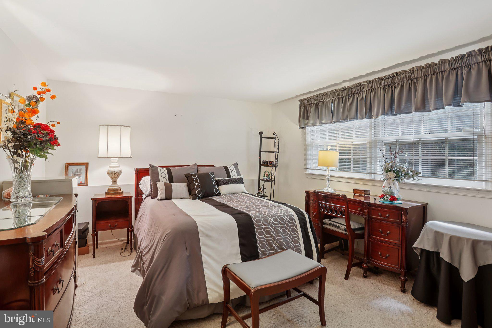 26 Regent Road Cherry Hill, NJ 08003 - Photo 8 of 36 a bed room with a bed and a table