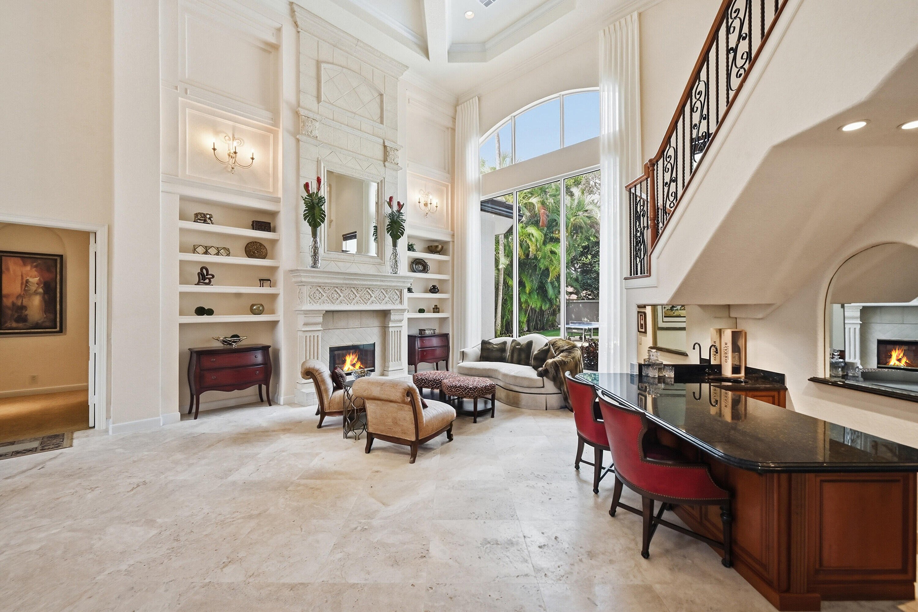 2425 Northwest 49th Lane Boca Raton, FL 33431 - Photo 5 of 46 a living room with furniture a fireplace and a large window with outer view