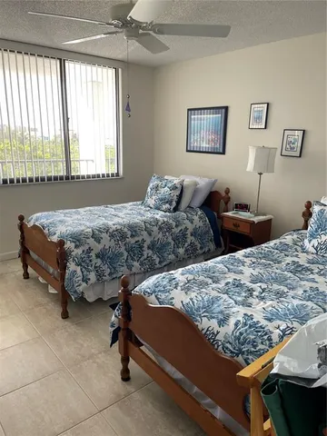 a bedroom with bed and window