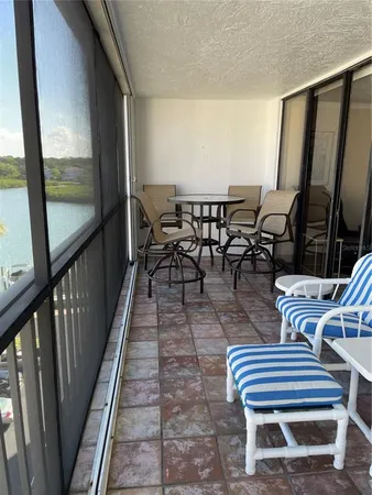 a view of a balcony with chairs