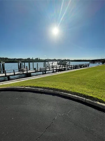 a view of swimming pool with outdoor seating and a garden
