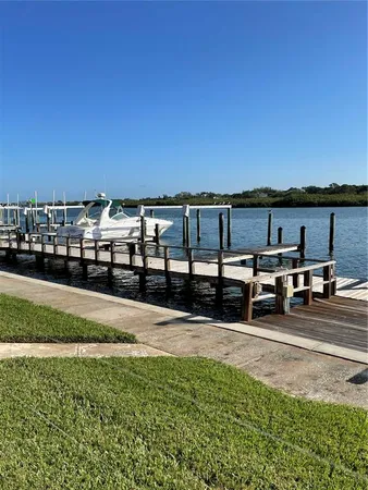 a view of swimming pool with outdoor seating and yard in back