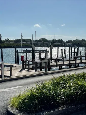 a view of swimming pool with outdoor seating and plants