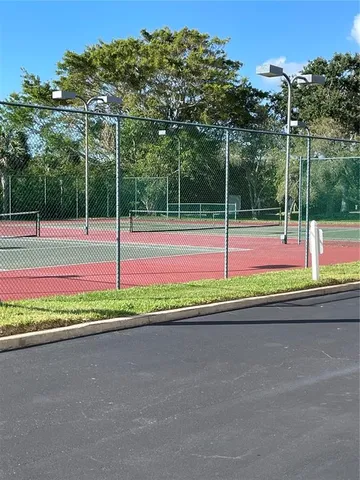 a view of a lake with a table and chairs