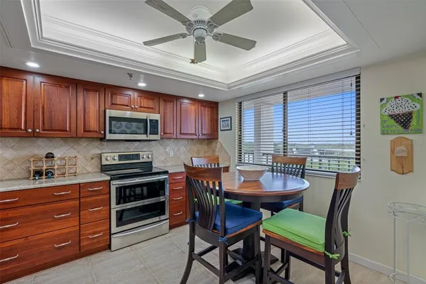 a dining room with furniture and window