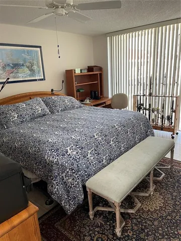 a living room with a couch and dresser