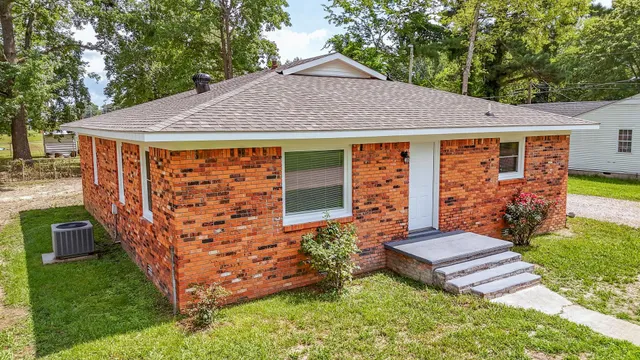 a front view of a house with garden