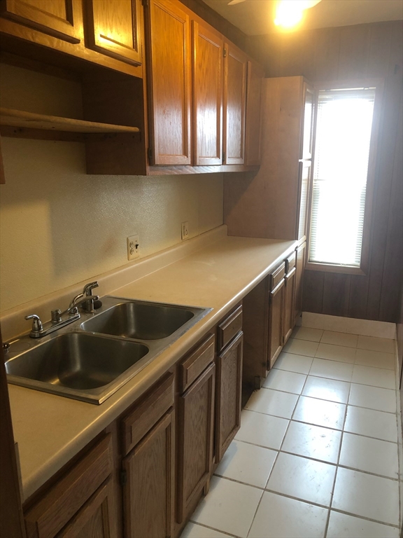 21 Whipple Street, Unit 3 Worcester, MA 01607 - Photo 4 of 8 a kitchen that has a sink and a stove
