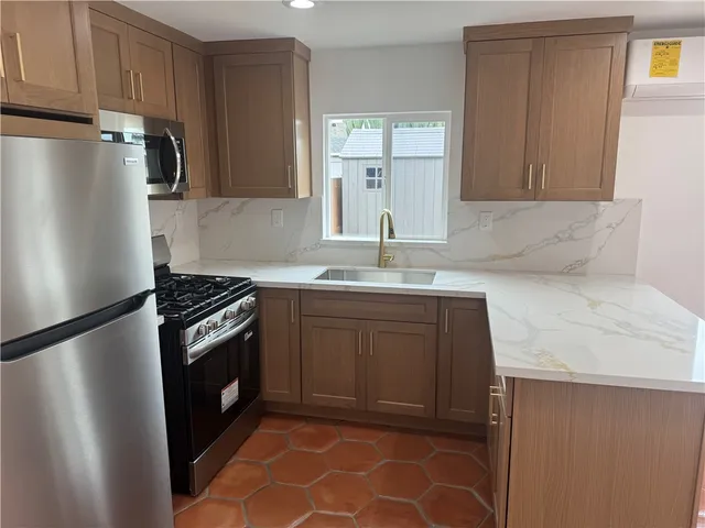 a view of an empty room and a window