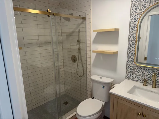 a car parked in front of white house