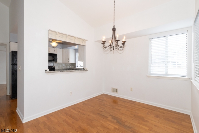 10 Crestmont Road Bedminster, NJ 07921 - Photo 12 of 41 a view of a room with wooden floor and chandelier