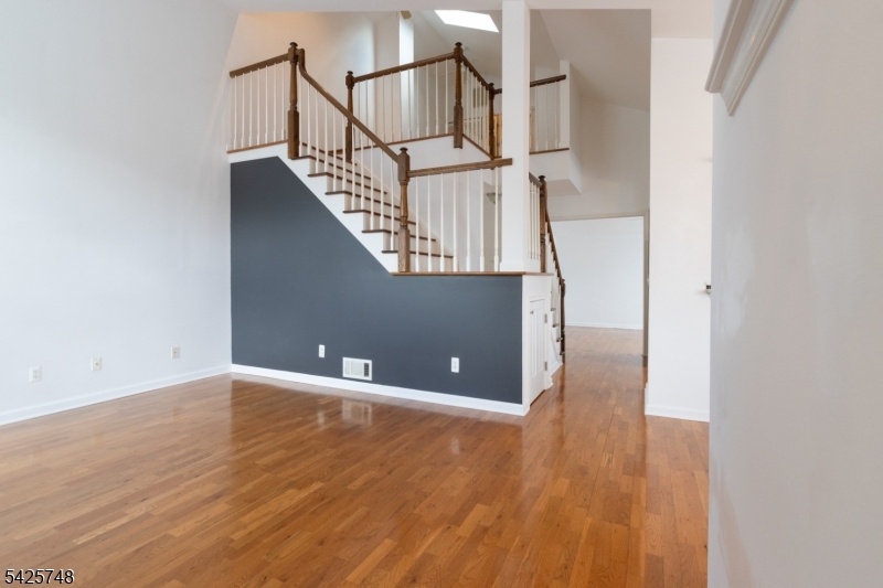 10 Crestmont Road Bedminster, NJ 07921 - Photo 17 of 41 a view of a room with wooden floor and staircase