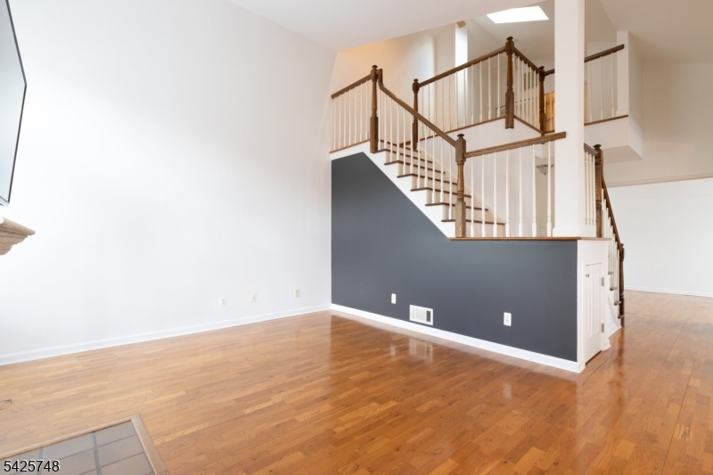 10 Crestmont Road Bedminster, NJ 07921 - Photo 18 of 41 a view of a big room with wooden floor and windows