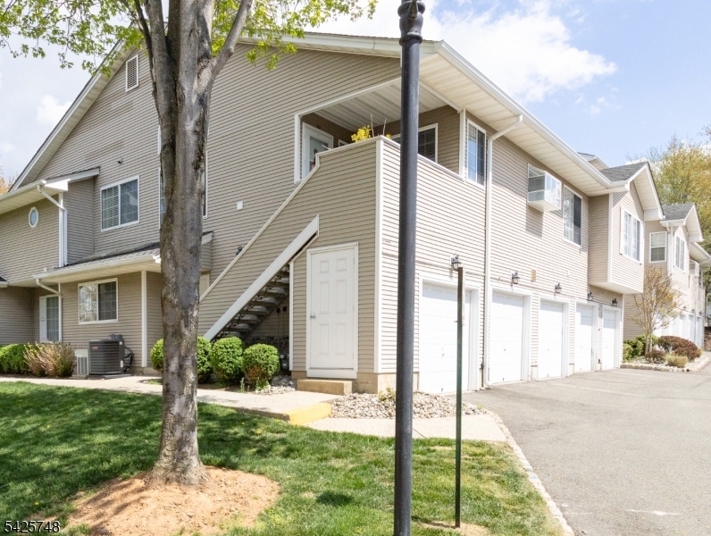 10 Crestmont Road Bedminster, NJ 07921 - Photo 2 of 41 a front view of a house with a yard