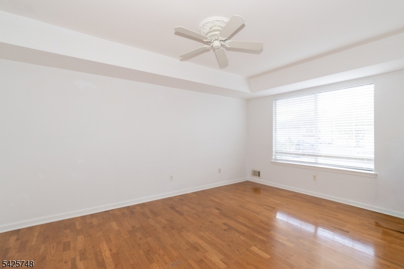 10 Crestmont Road Bedminster, NJ 07921 - Photo 21 of 41 an empty room with a window and a fan