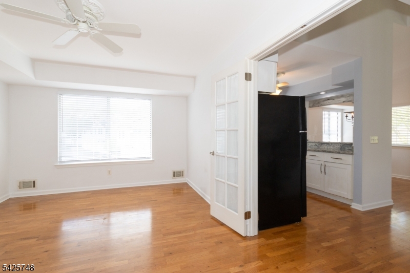 10 Crestmont Road Bedminster, NJ 07921 - Photo 22 of 41 a view of a kitchen with wooden floor and a window